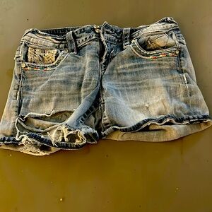 Vigoss distressed shorts. Cute sun pattern on back. Size 3/4.